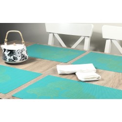 Teapot in view of all four vibrant green Verdigris woven vinyl tablemats