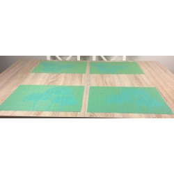 Dining table setting of vibrant green Verdigris woven vinyl tablemats