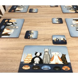 Animal design tablemats of Hungry Cats, corkbacked on wooden kitchen-dining table