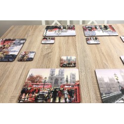 Wooden dining table with Streets of London corkbacked placemats by Plymouth Pottery