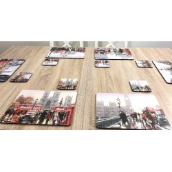 Angled view of wooden dining table with Streets of London corkbacked placemats by Plymouth Pottery