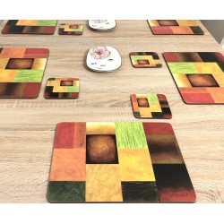 Majestic design of vibrantly coloured corkbacked placemats on wooden dining table