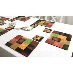 Majestic design of Plymouth Pottery corkbacked placemats on dining table with white tablecloth