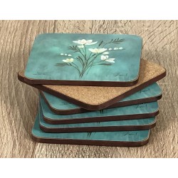 Infinity corkbacked floral coasters fanned out with base displayed