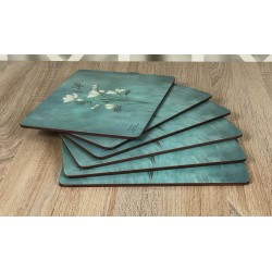 Infinity, teal blue background, corkbacked floral placemats fanned out all six mats